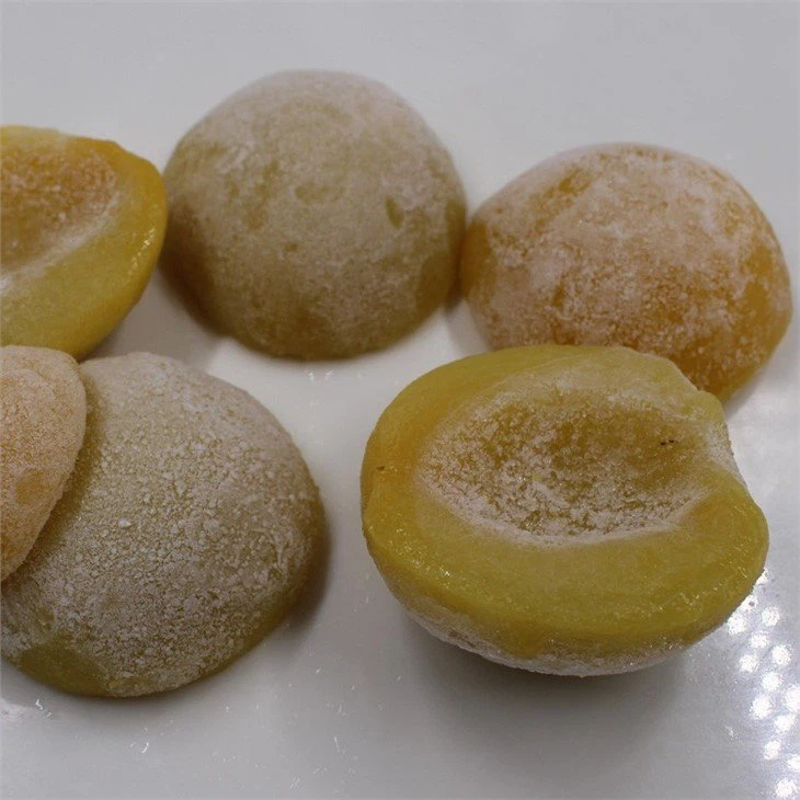 frozen yellow peach cut into halves